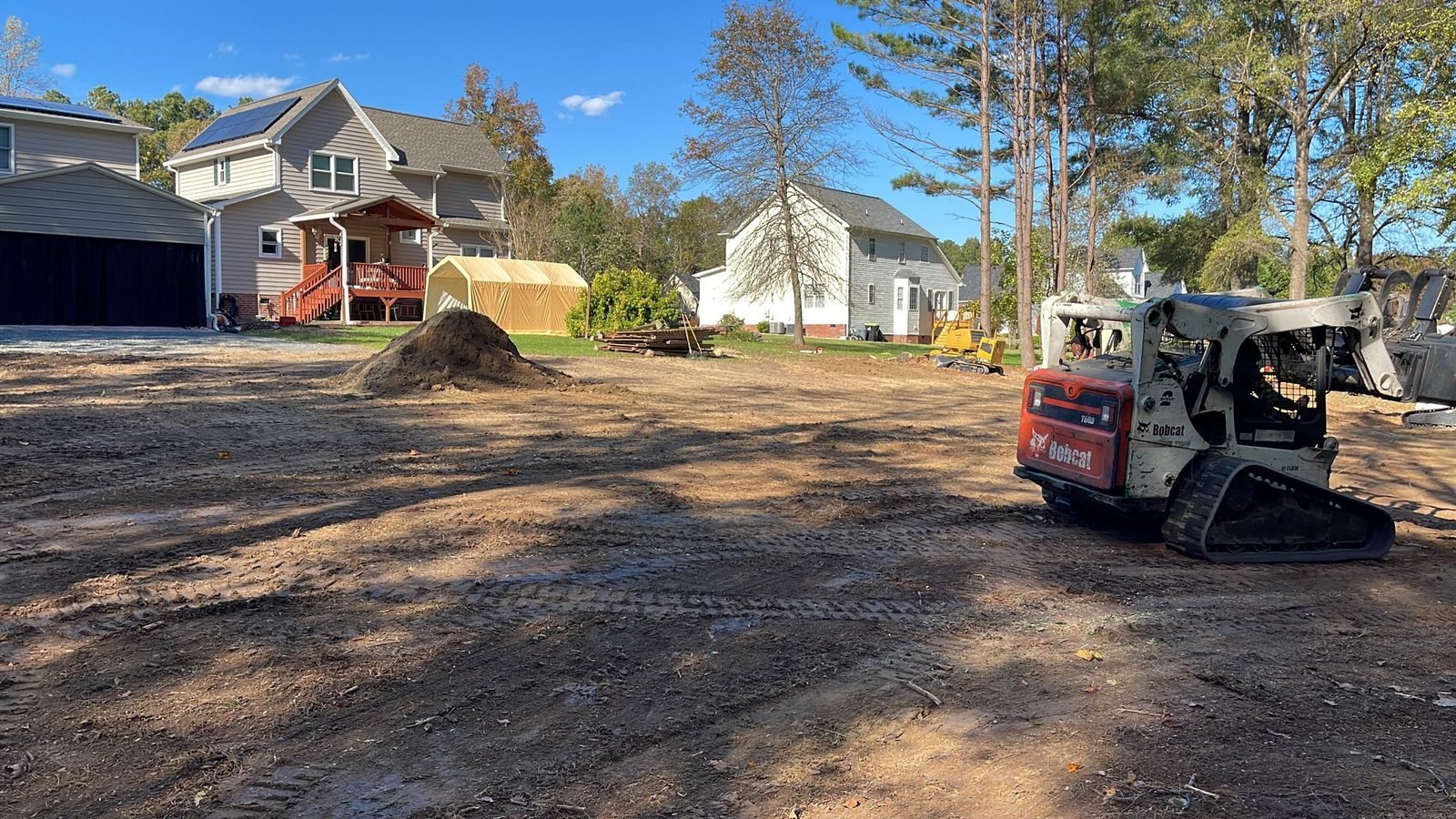 Aerial view of a full tree removal job with crane and chipper